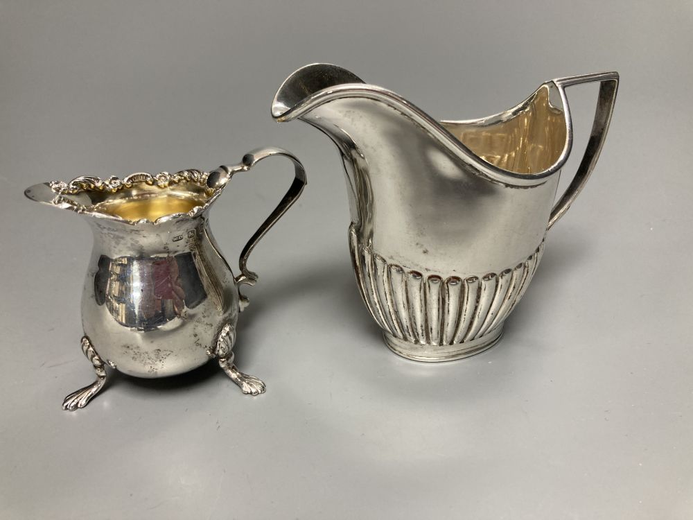 A late Victorian small silver cream jug, Birmingham, 1898, 57mm and a similar silver cream jug, London, 1891,